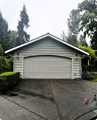 Simple garage door with concrete driveway